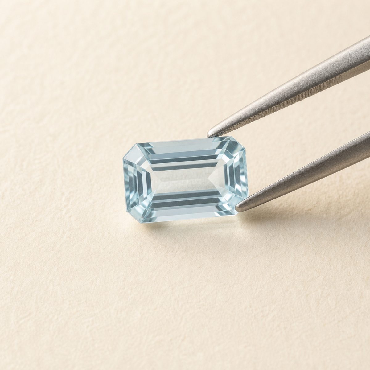 Aquamarine · No. 130 held in tweezers on ivory paper